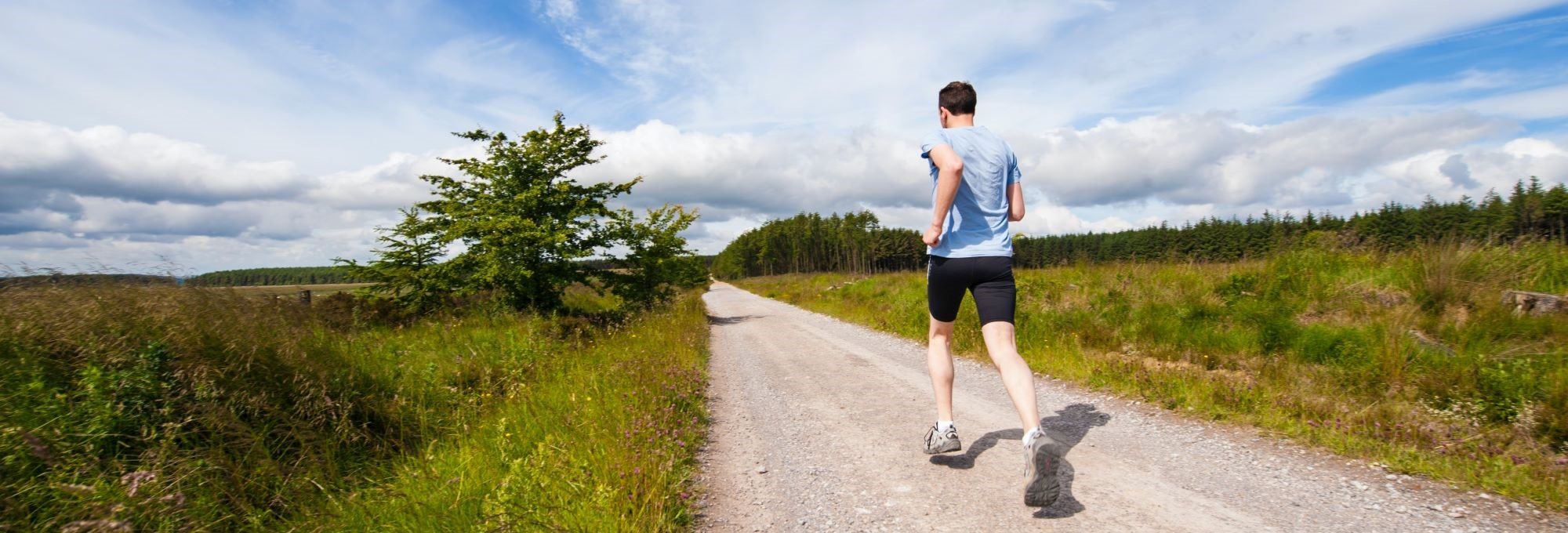 A person running along a country road