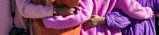 Children with their arms around each other